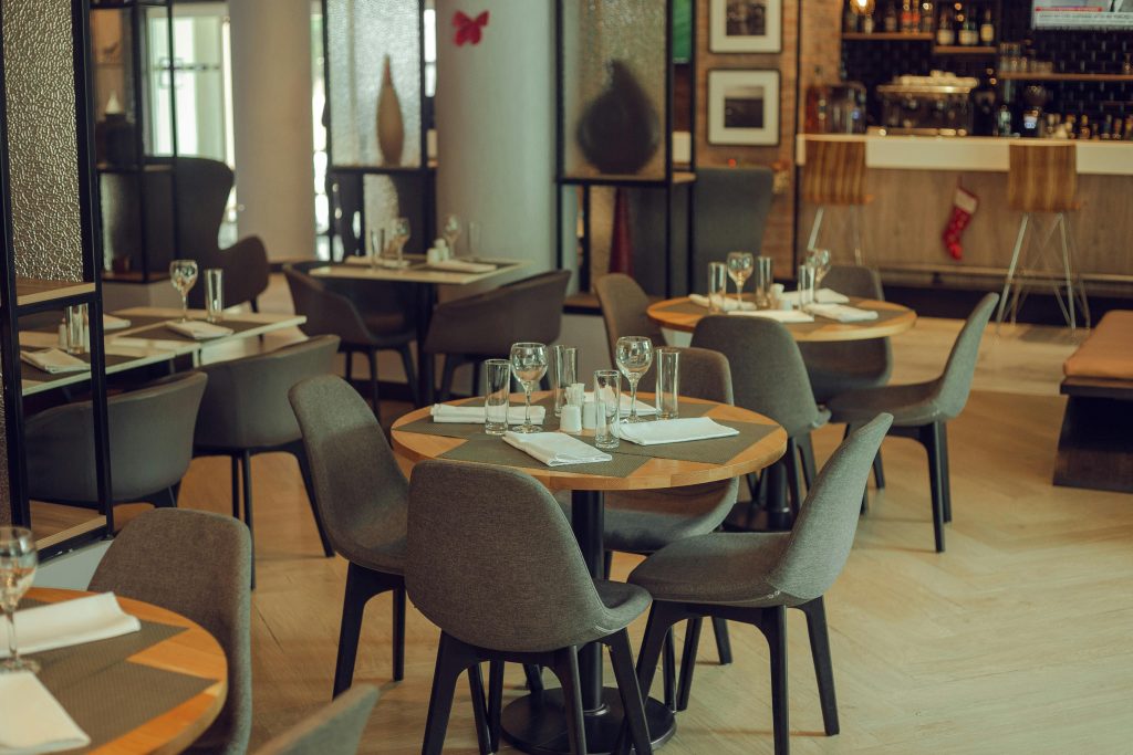 Commercial flooring installation in a contemporary restaurant interior with stylish dining area